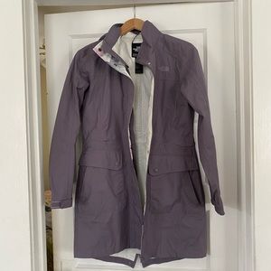 Long North face rain jacket, purple with waist cinch.